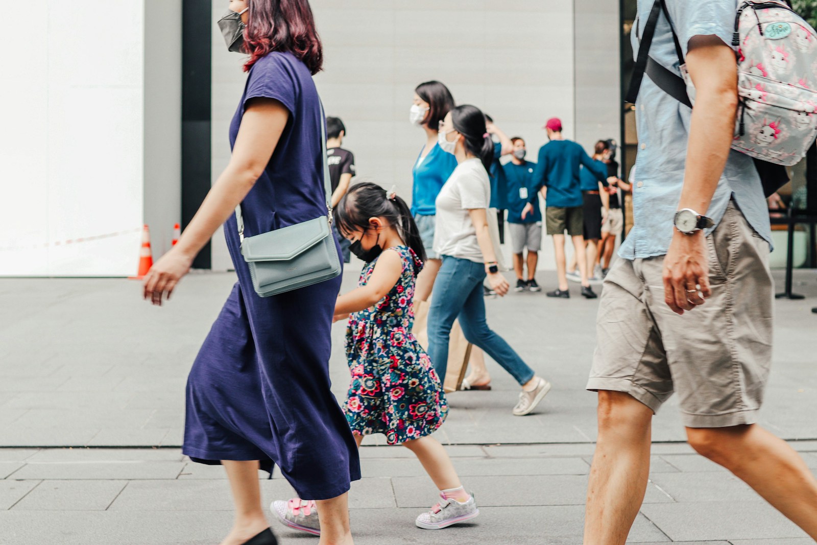 People walking along Orchard Road in Singapore.