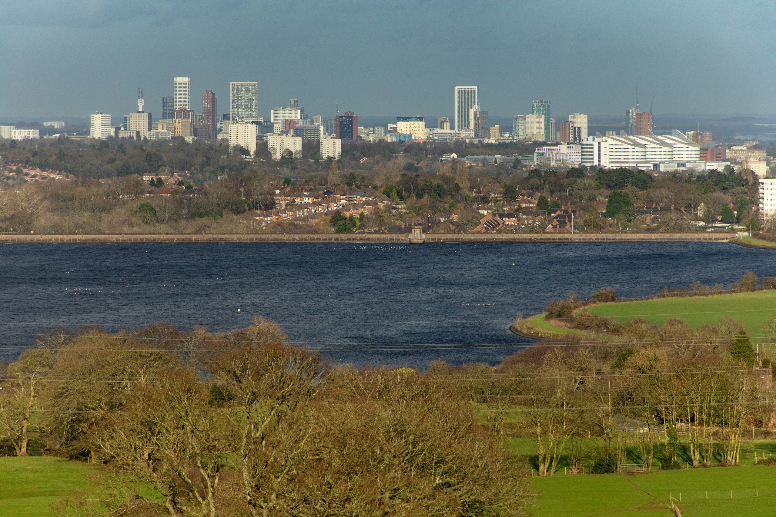 Birmingham skyline and green hills. Destination view for West Midlands, England.